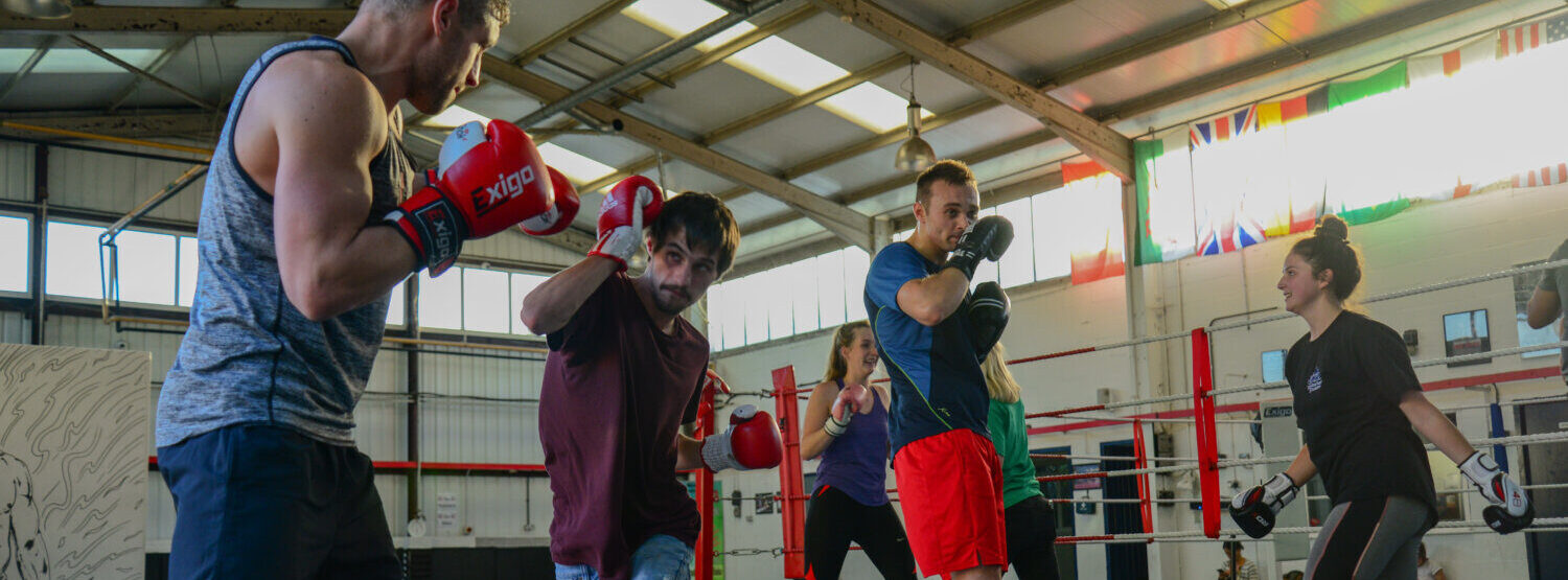 Coach boxing with participants