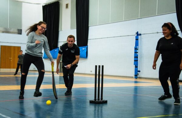 Coach supporting inclusive cricket