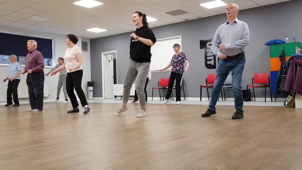 Older people dancing in a Move Momentum Gems class