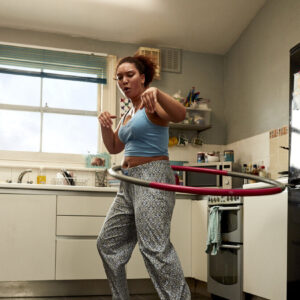 This Girl Can - woman hula hooping in kitchen