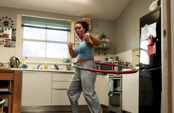 This Girl Can - woman hula hooping in kitchen