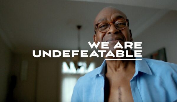 We Are Undefeatable campaign logo and man with surgery scar