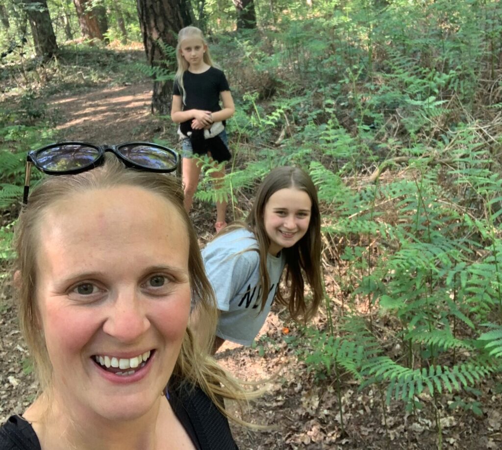 Ruth exercising with her daughters, smiling due to positive relationship with exercise