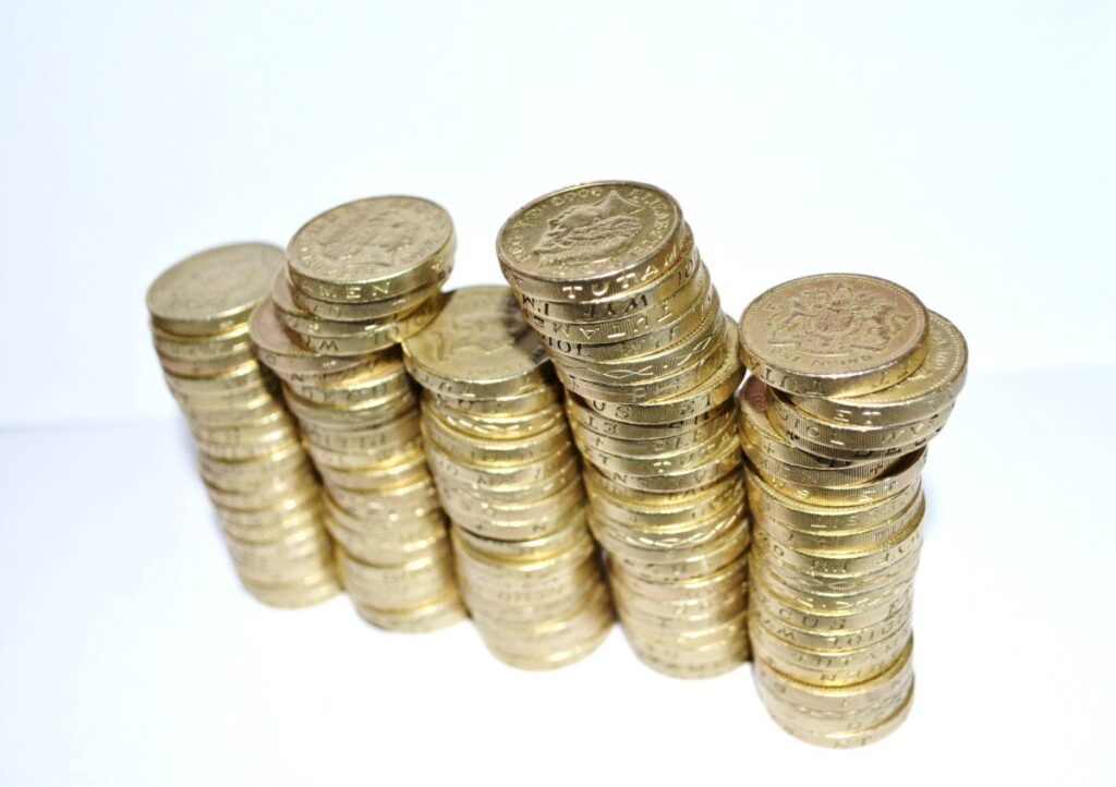 Stacks of pound coins - generate income during COVID-19
