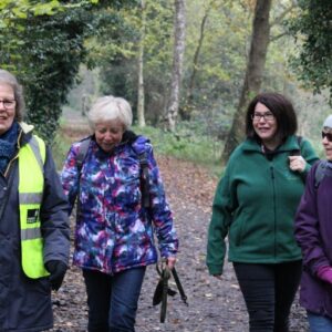 Volunteer walking with group - finding volunteers