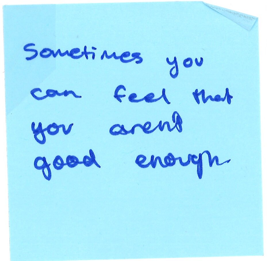 handwritten post-it note saying "sometimes you can feel that you aren't good enough"
