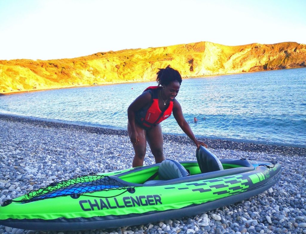 Kosiwa with a kayak on the beach