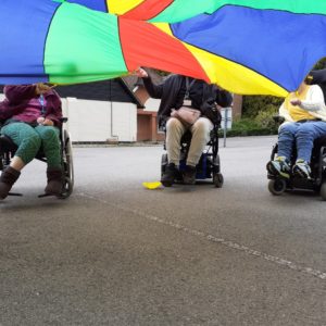 Enham Trust members playing parachute games