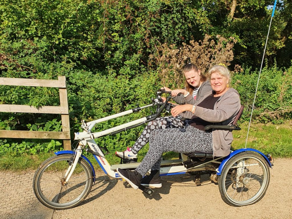 Chantelle and her mum on a tandem bike at Cycles4All