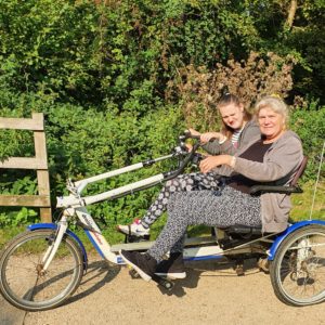 Chantelle and her mum on a tandem bike at Cycles4All