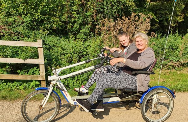 Chantelle and her mum on a tandem bike at Cycles4All