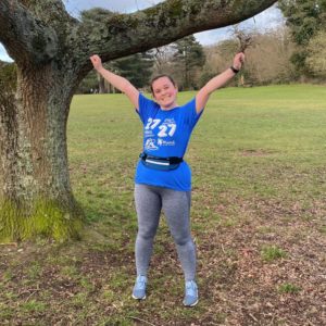 Georgia celebrating completing 27 miles after over coming her running anxiety.