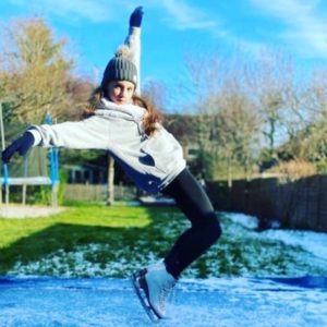 Ava skating on a homemade ice rink in her garden during lockdown