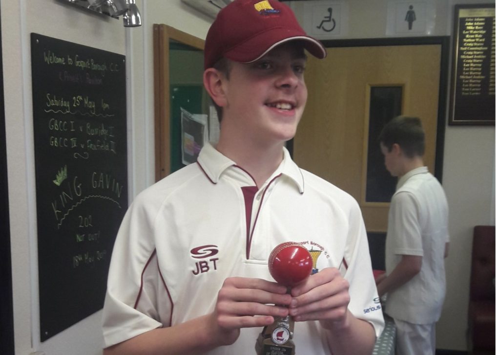 Josh with a trophy after playing cricket with a disability 