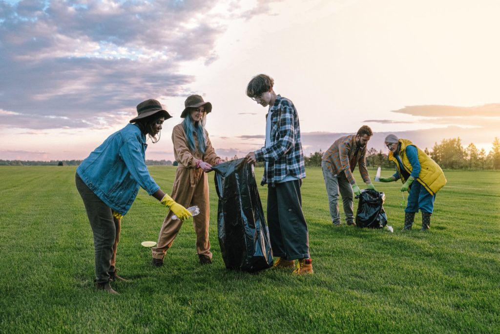 People of all ages outdoors litter picking