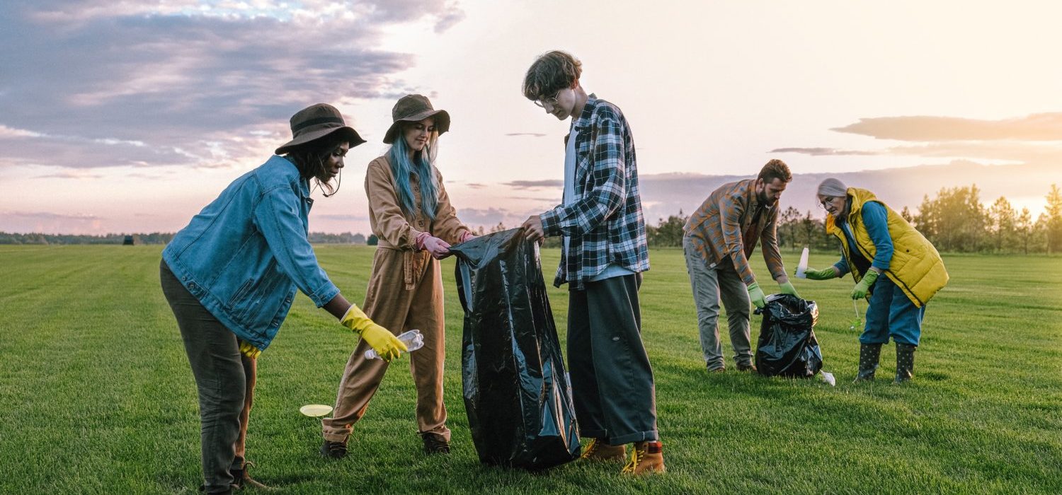 People of all ages outdoors litter picking