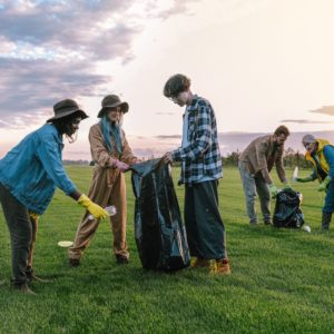 People of all ages outdoors litter picking