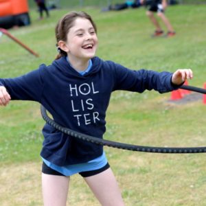 Girl playing thanks to Opening school facilities project