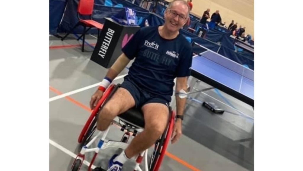 Simon playing wheelchair table tennis