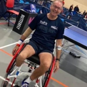 Simon playing wheelchair table tennis