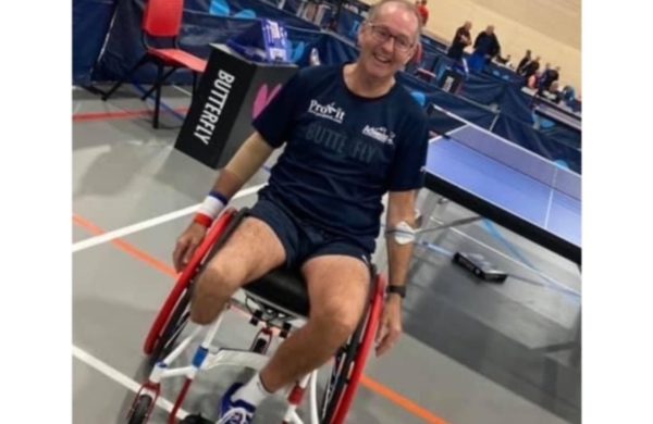 Simon playing wheelchair table tennis