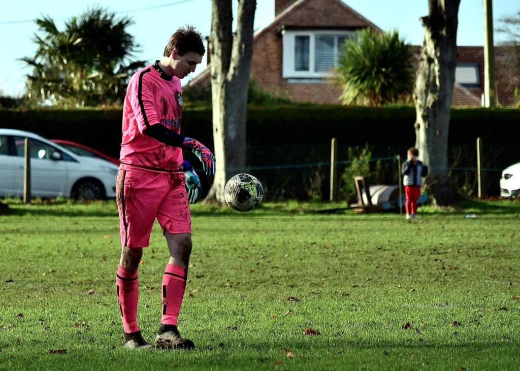 A man on a field with a football.