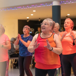 A group of older adults dancing.