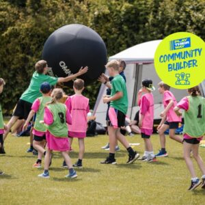A group of children playing Kinball.