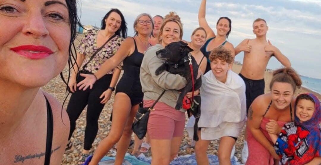A group of friends gathered on the beach.