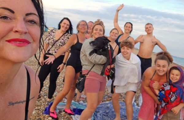 A group of friends gathered on the beach.