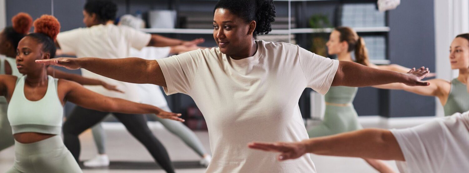 A woman in a yoga class.