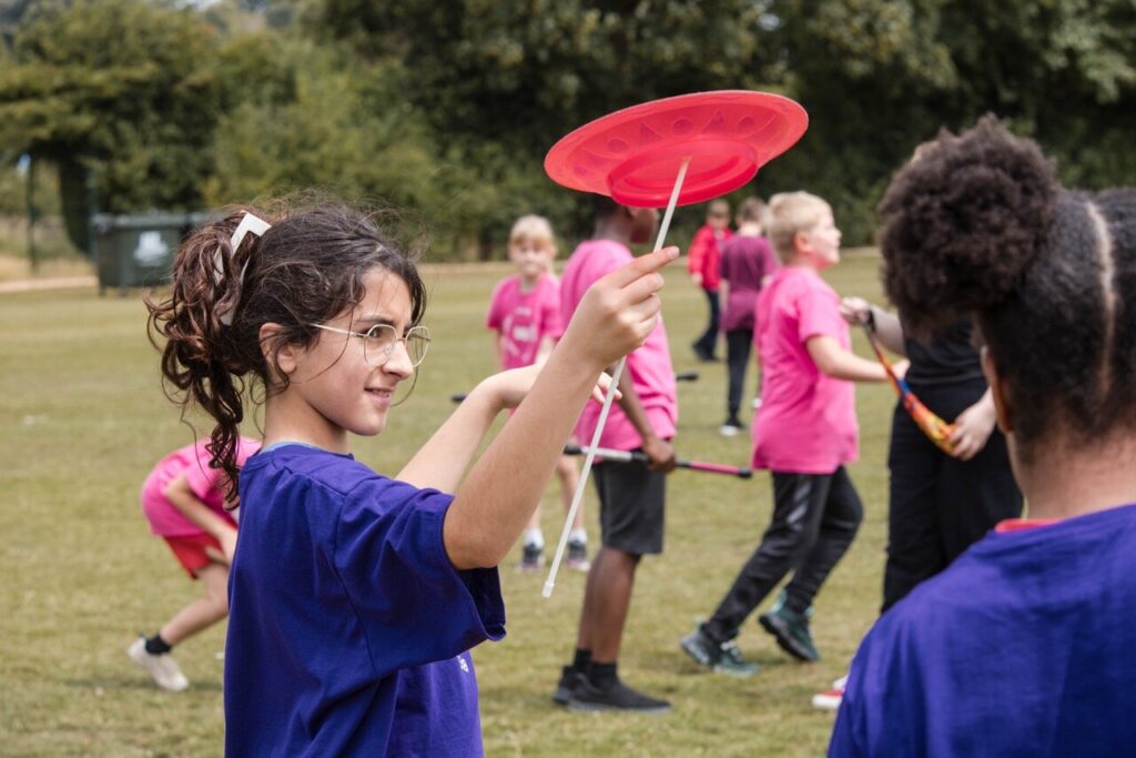 a young girl practising circus skills