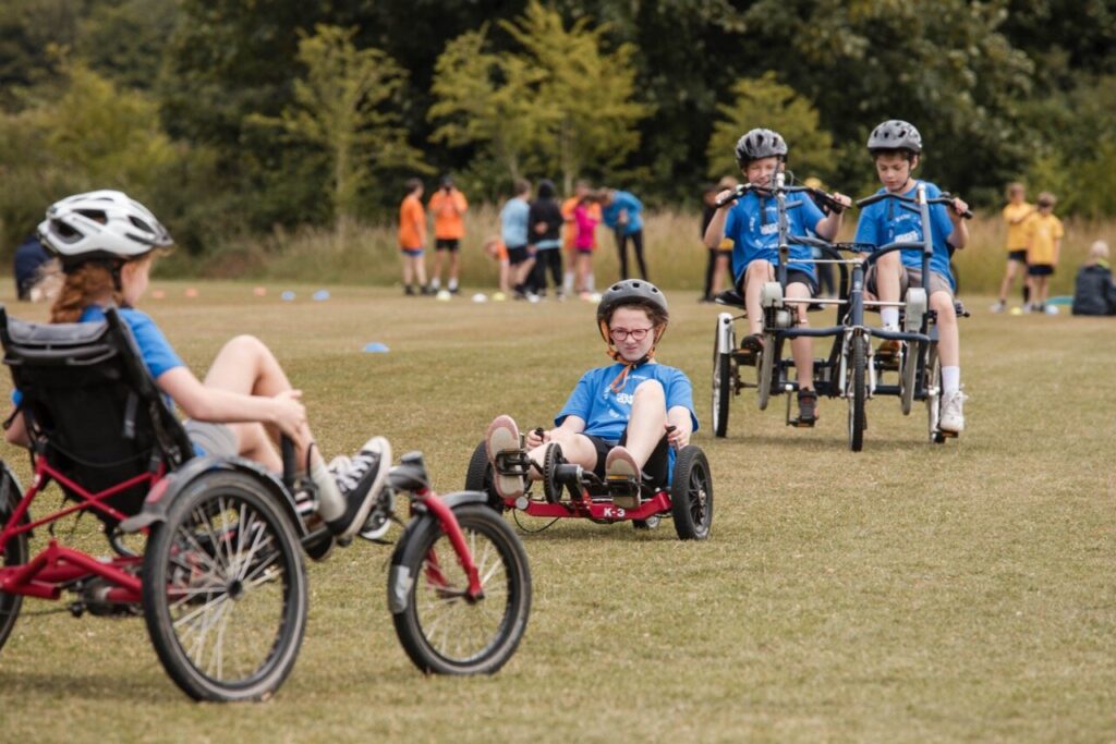 young people on a variety o different bikes, allowing for different accessibility levels