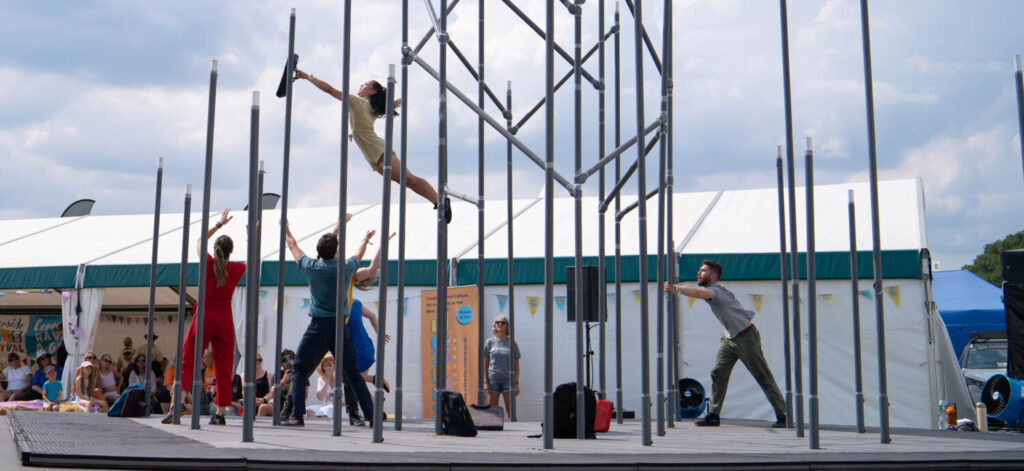 Metal framing being used by acrobats.
