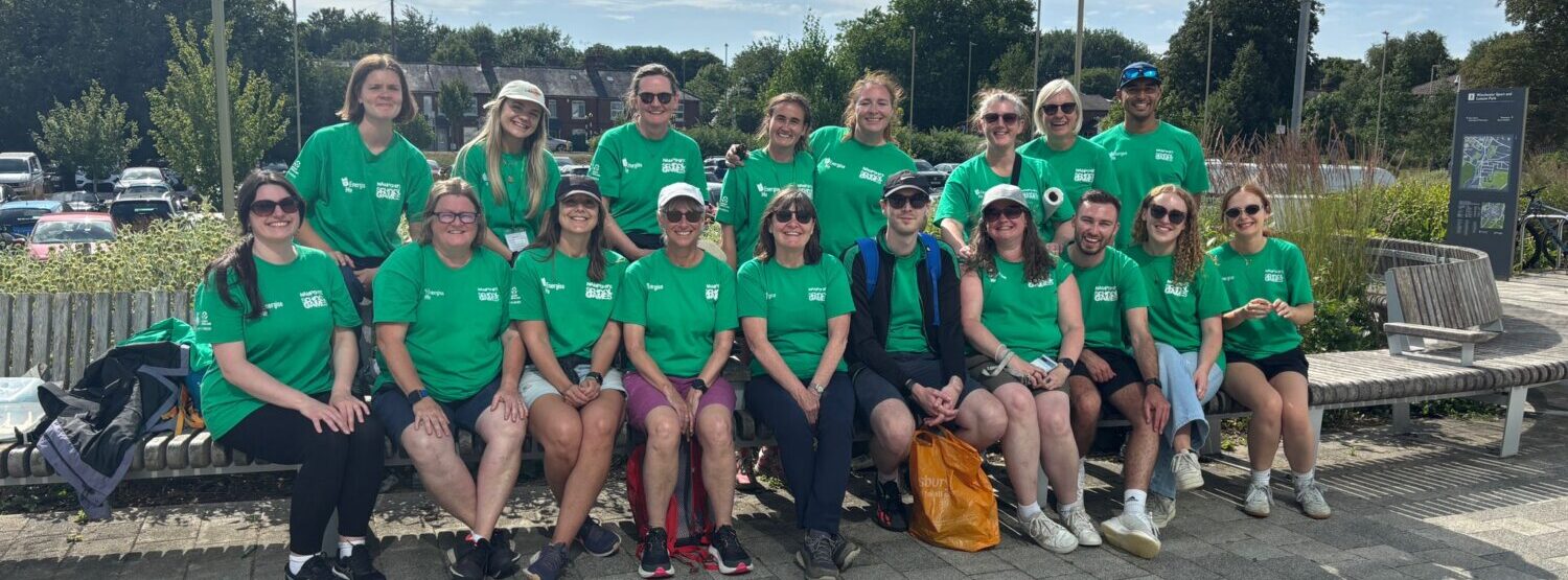 Decorative picture of the Energise Me team. All wearing bright green tshirts at the Hampshire school Games