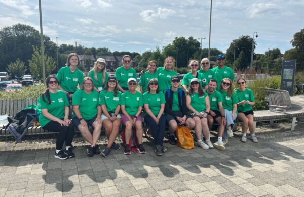 Decorative picture of the Energise Me team. All wearing bright green tshirts at the Hampshire school Games