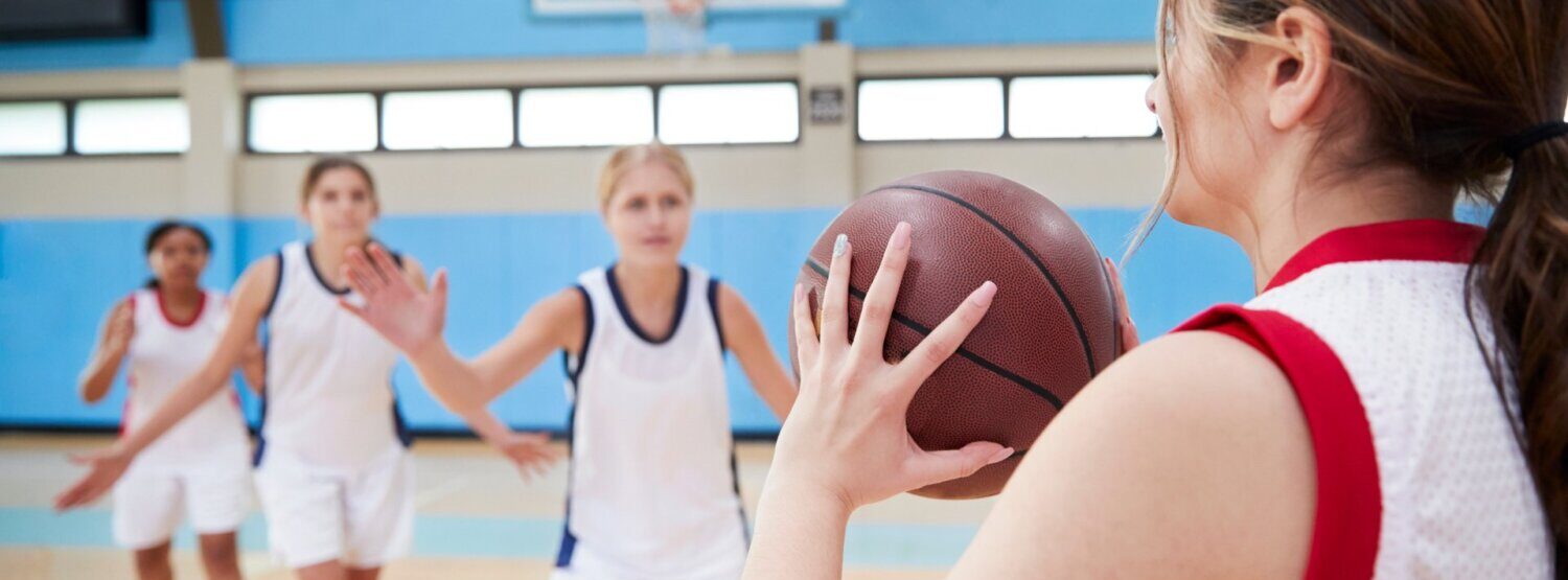 Girls playing basketball.