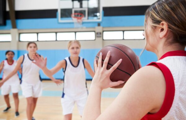 Girls playing basketball.