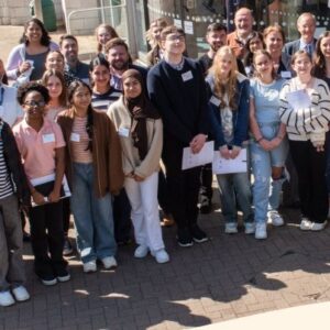 Group of people standing on the street amling.